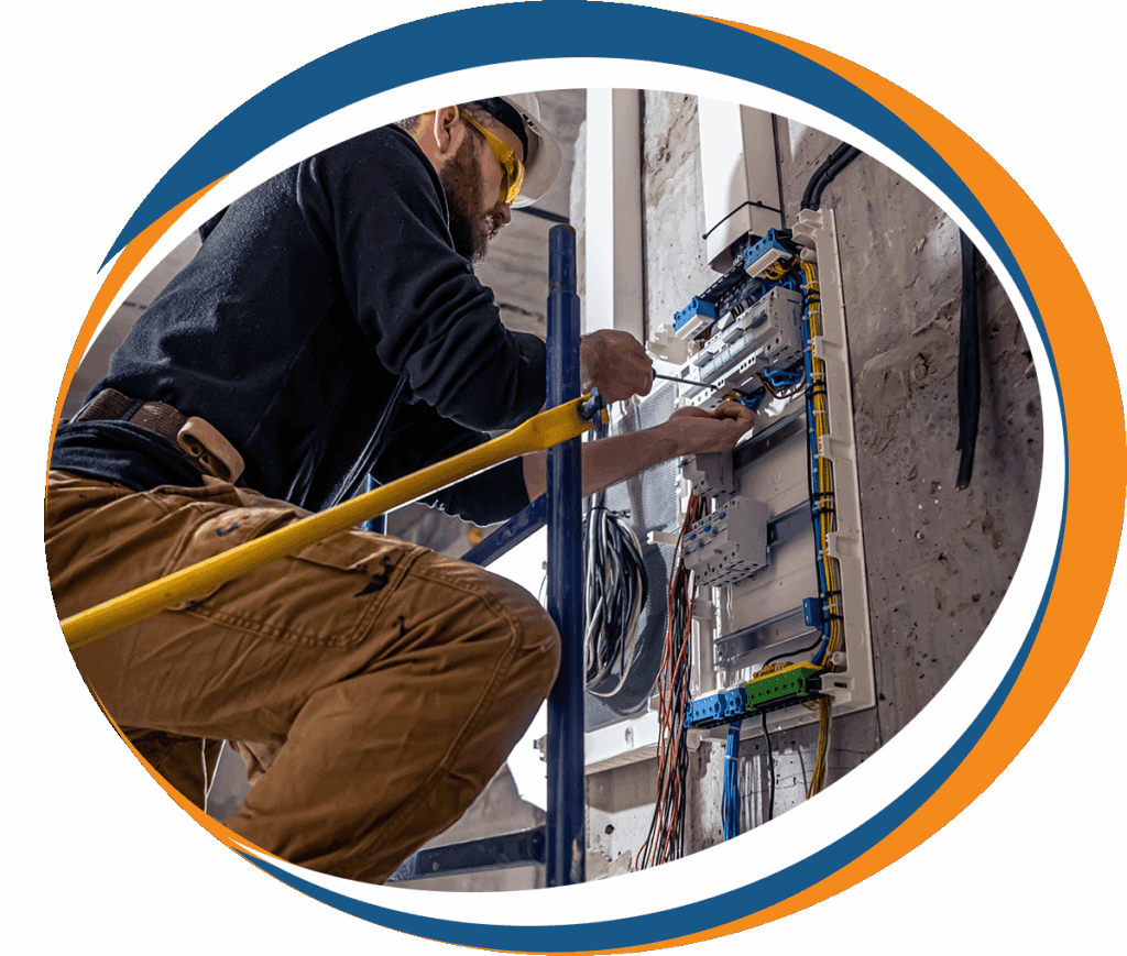Licensed electrician repairing wiring inside an electrical panel